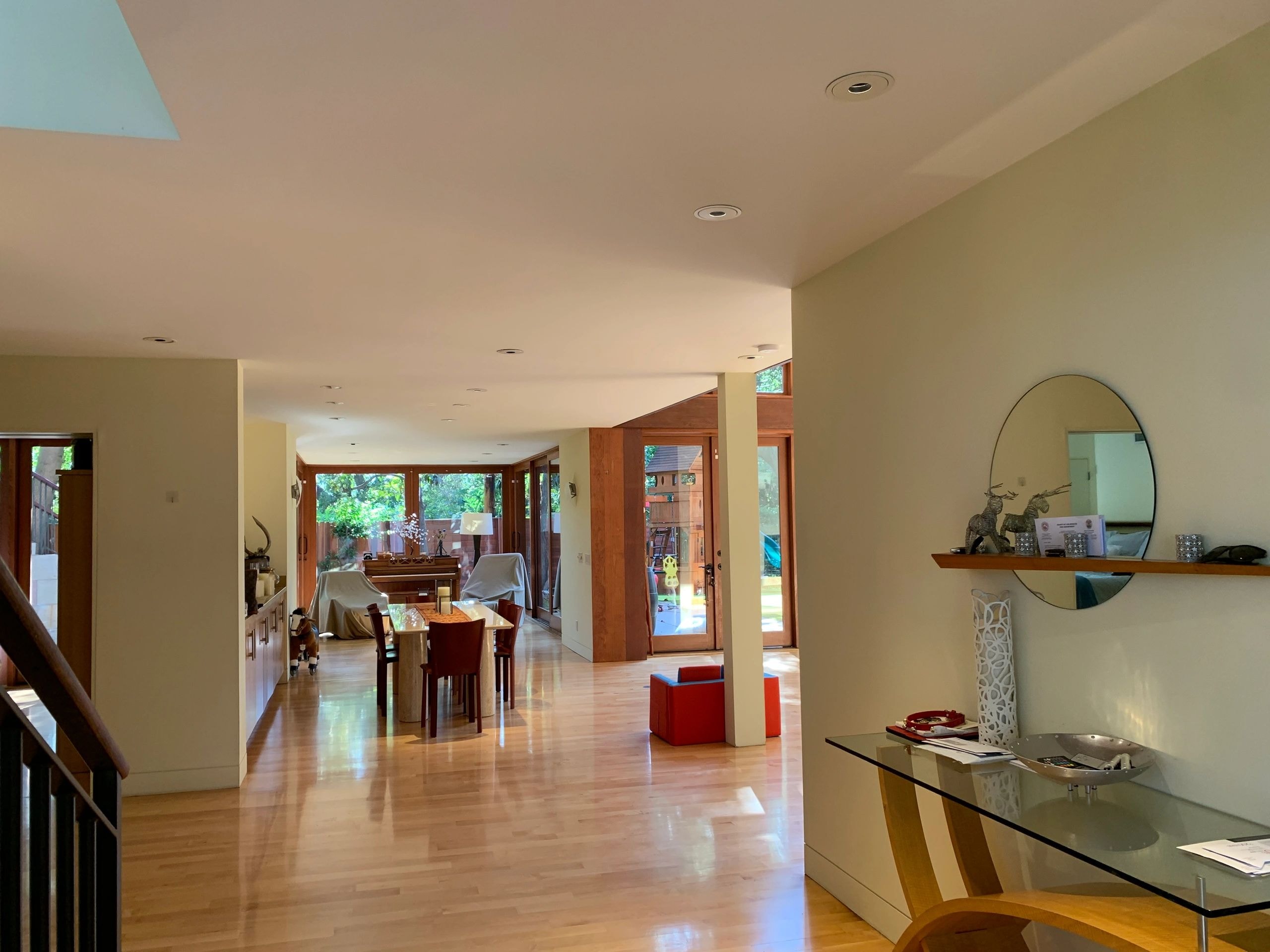 Open-concept home interior with polished hardwood floors